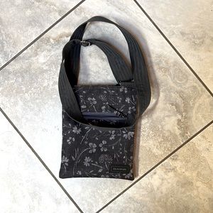DaKine Jive Crossbody bag. 8"x9 1/2" zippered pocket, cross body shoulder strap.
